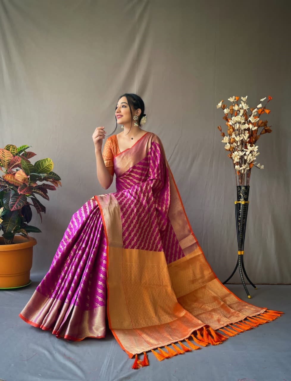 Rust and maroon Patola silk saree with contrast meenakari weave